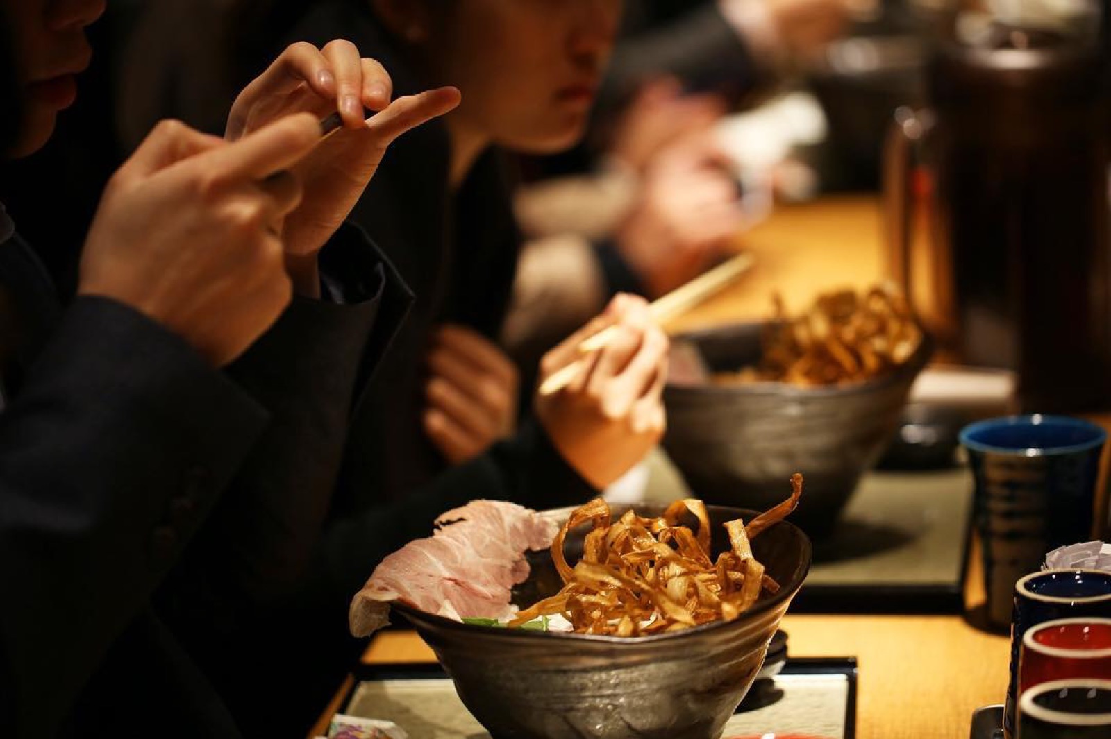 Guests sharing a meal at Zagin Soba